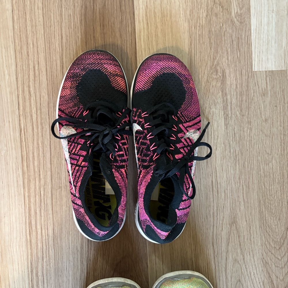 Nike Pink and Black Flyknit Athletic Shoes